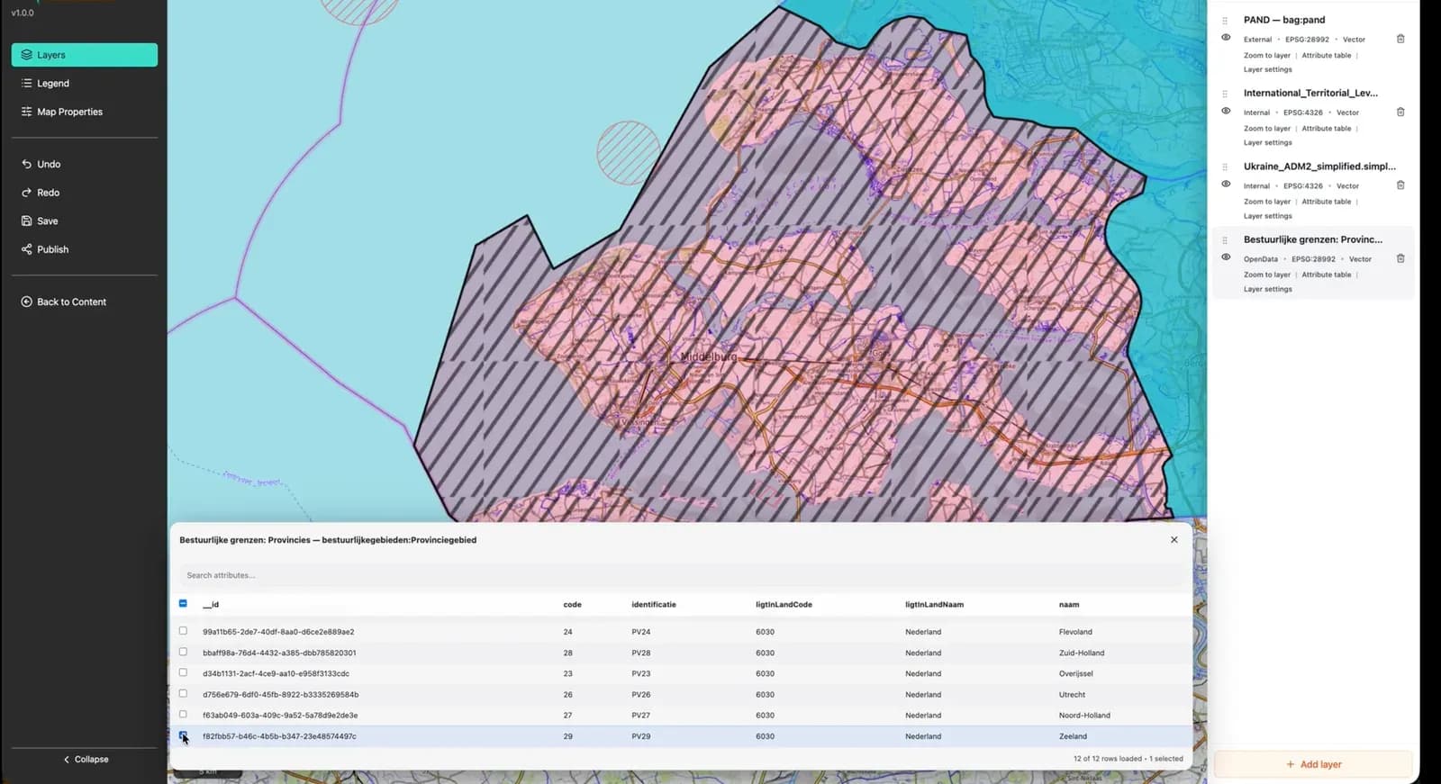 The attribute table for the Dutch provincial boundaries layer, with the Zeeland row selected and the matching polygon highlighted on the map above it.